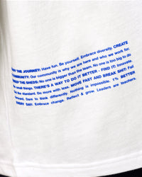 Man wearing Static Grit Heavyweight Oversized Tee - White-Electric Indigo | Model:Malebo | Size:M