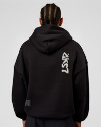 Man wearing Static Grit Unisex Boxy Hoodie - Black-Alloy | Model:Malebo | Size:M