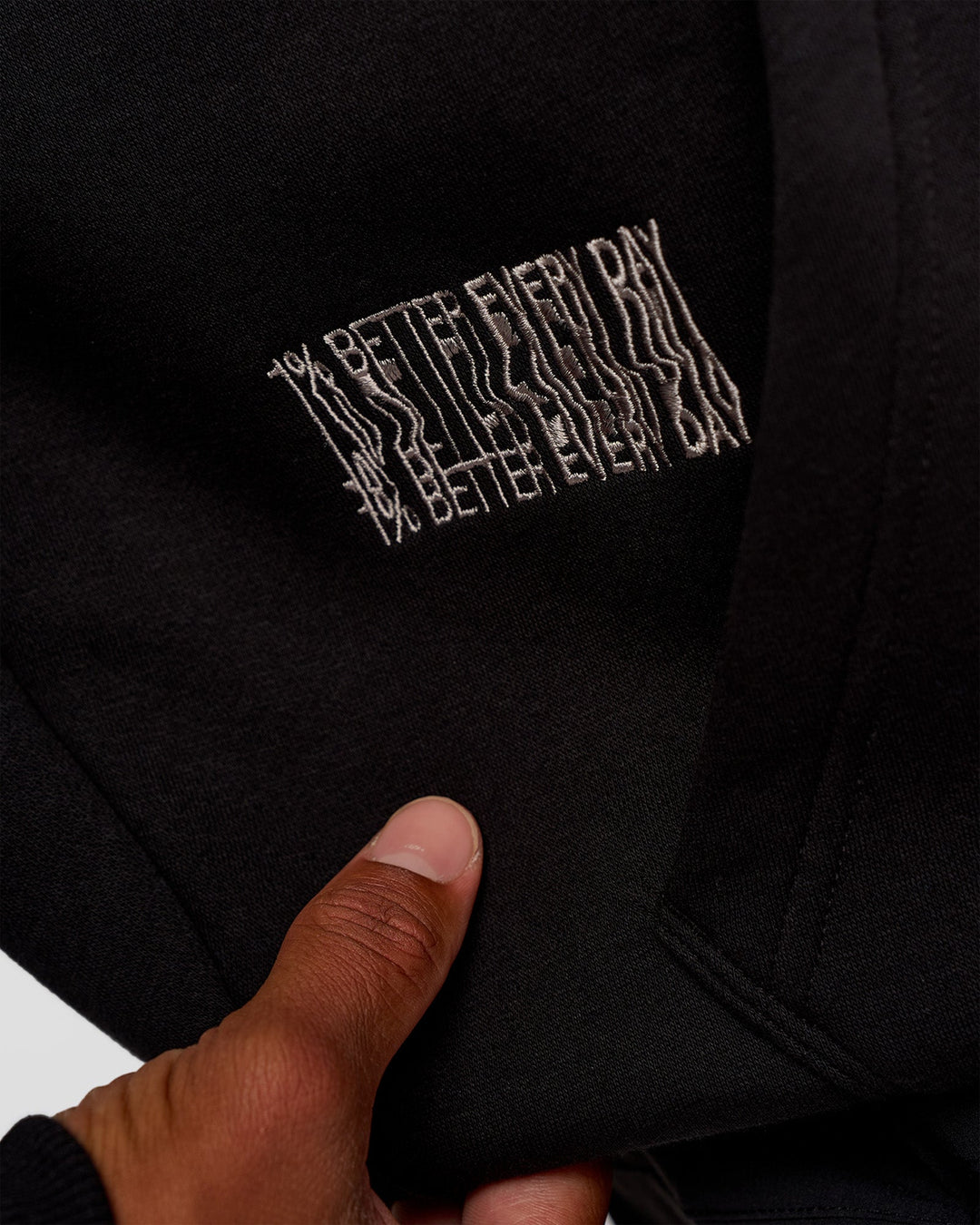 Man wearing Static Grit Unisex Boxy Hoodie - Black-Alloy | Model:Malebo | Size:M