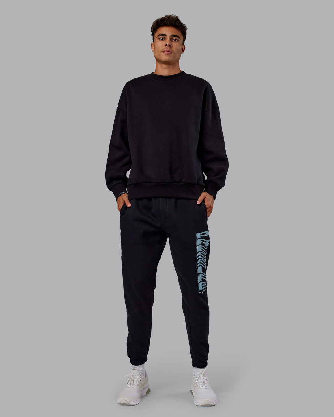 Man wearing Static Track Pant - Black-Skyride | Model:Jaxon | Size:M