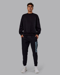 Man wearing Static Track Pant - Black-Skyride | Model:Jaxon | Size:M