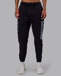 Man wearing Static Track Pant - Black-Skyride | Model:Jaxon | Size:M