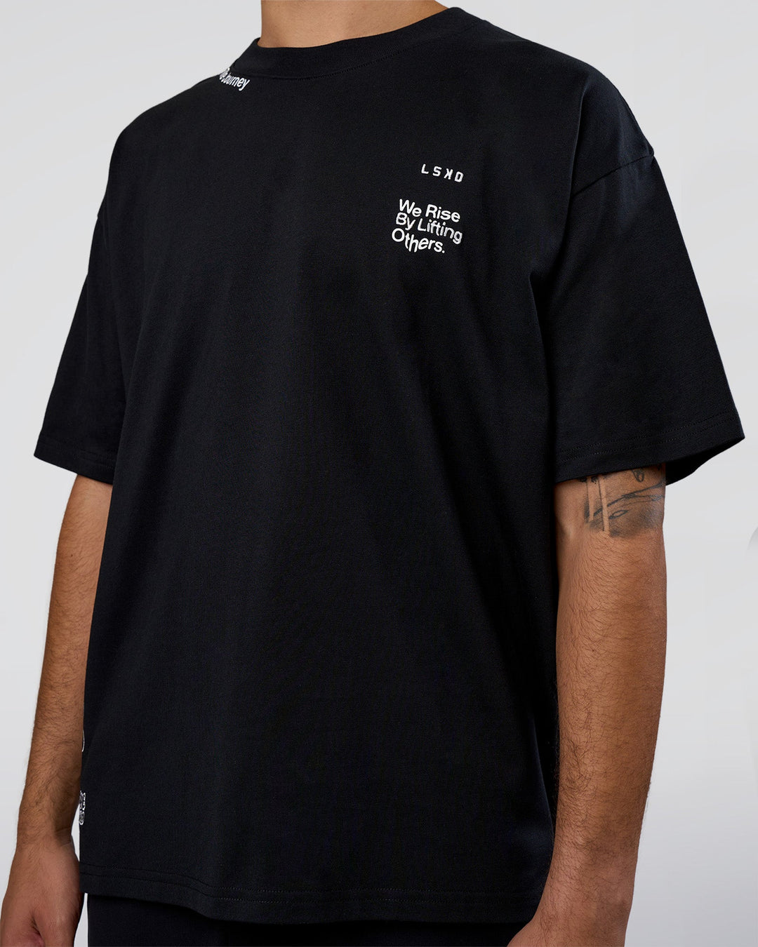 Man wearing Sticker Heavyweight Oversized Tee - Black-White | Model:Zoran | Size:M