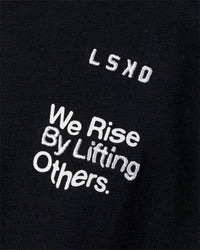 Man wearing Sticker Heavyweight Oversized Tee - Black-White | Model:Zoran | Size:M