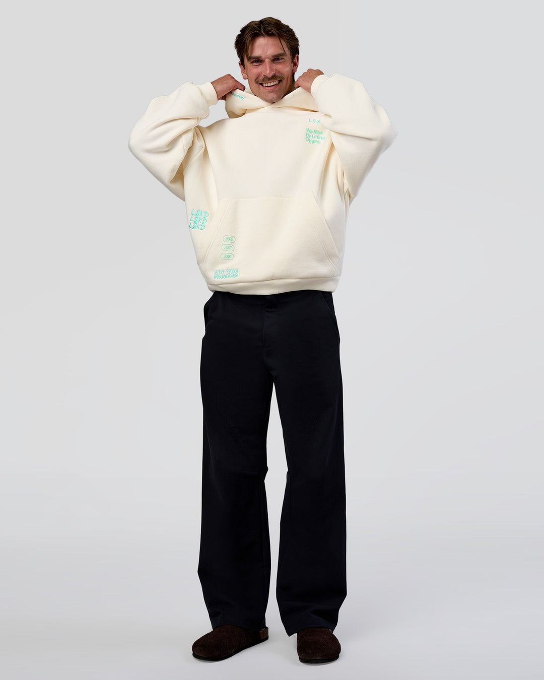 Man wearing Sticker Unisex Oversized Hoodie - Off White-Jelly Mint | Model:Konnor | Size:M