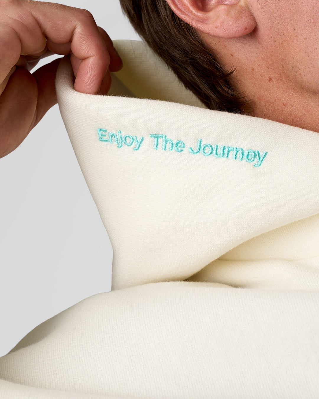 Man wearing Sticker Unisex Oversized Hoodie - Off White-Jelly Mint | Model:Konnor | Size:M