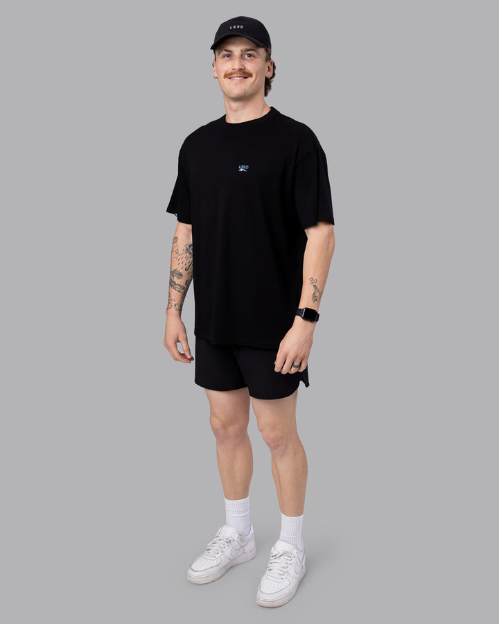 Man wearing Digital World Tee FLXCotton Oversize in Black | Size:M
