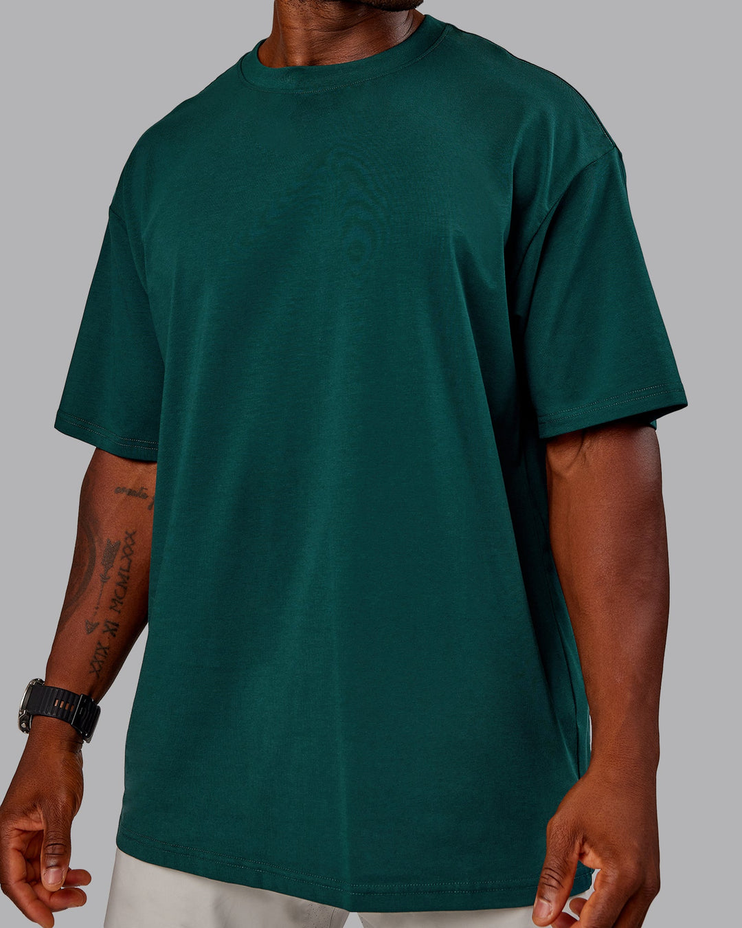 Man wearing Variation FLXCotton Oversized Tee in Dark Moss-Digital Mist | Size:M