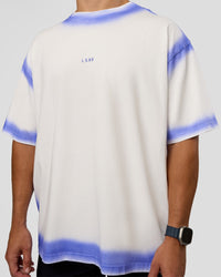 Man wearing Urban Blur Heavyweight Unisex Oversized Tee - Off White-Power Cobalt | Model:Jaiden | Size:M