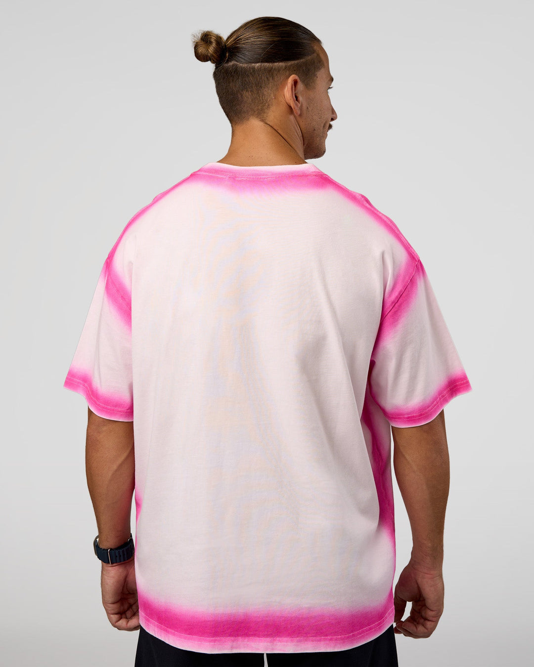 Man wearing Urban Blur Heavyweight Unisex Oversized Tee - Off White-Ultra Pink | Model:Jaiden | Size:M