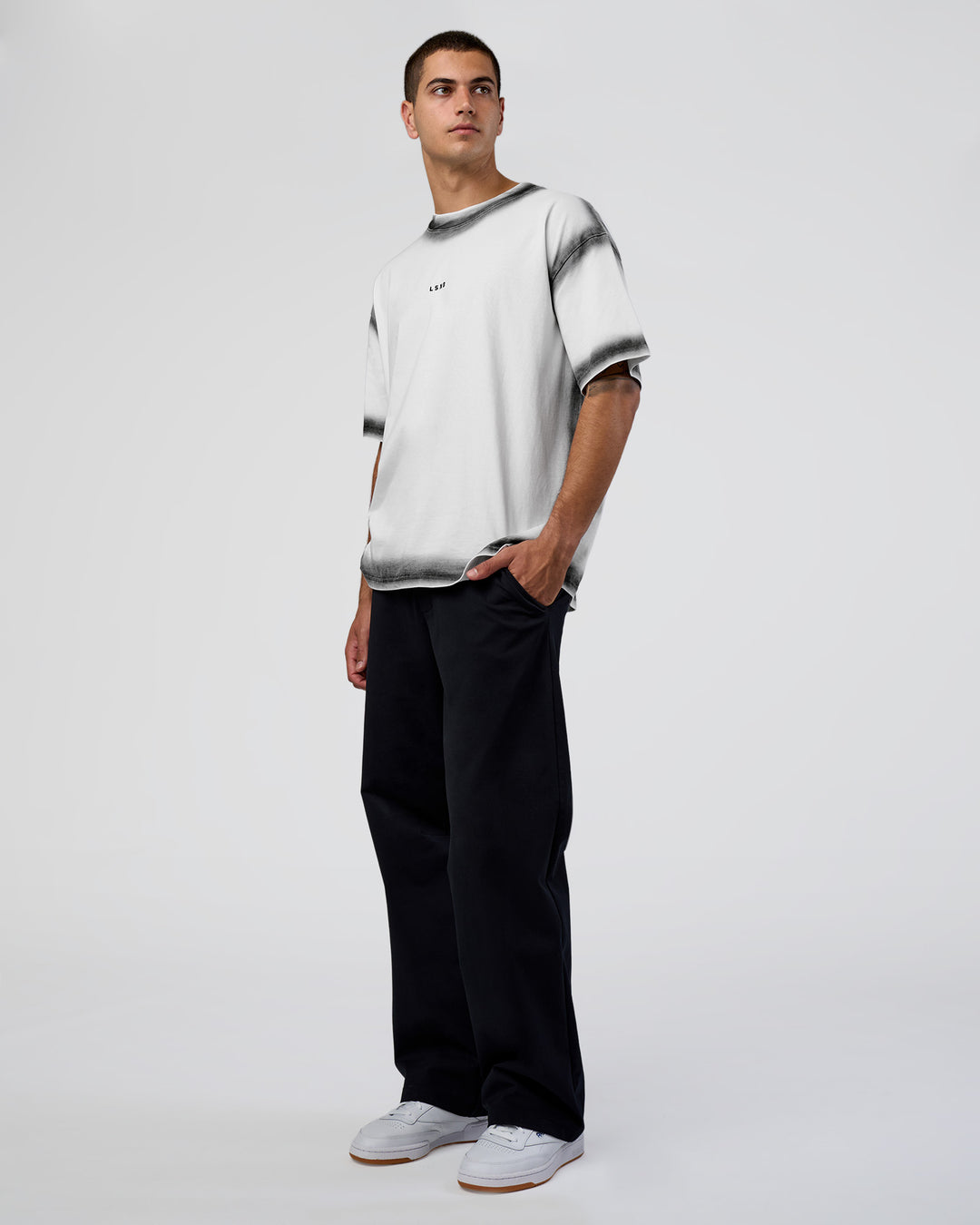 Man wearing Urban Blur Heavyweight Unisex Oversized Tee - White-Black | Model:Zoran | Size:M