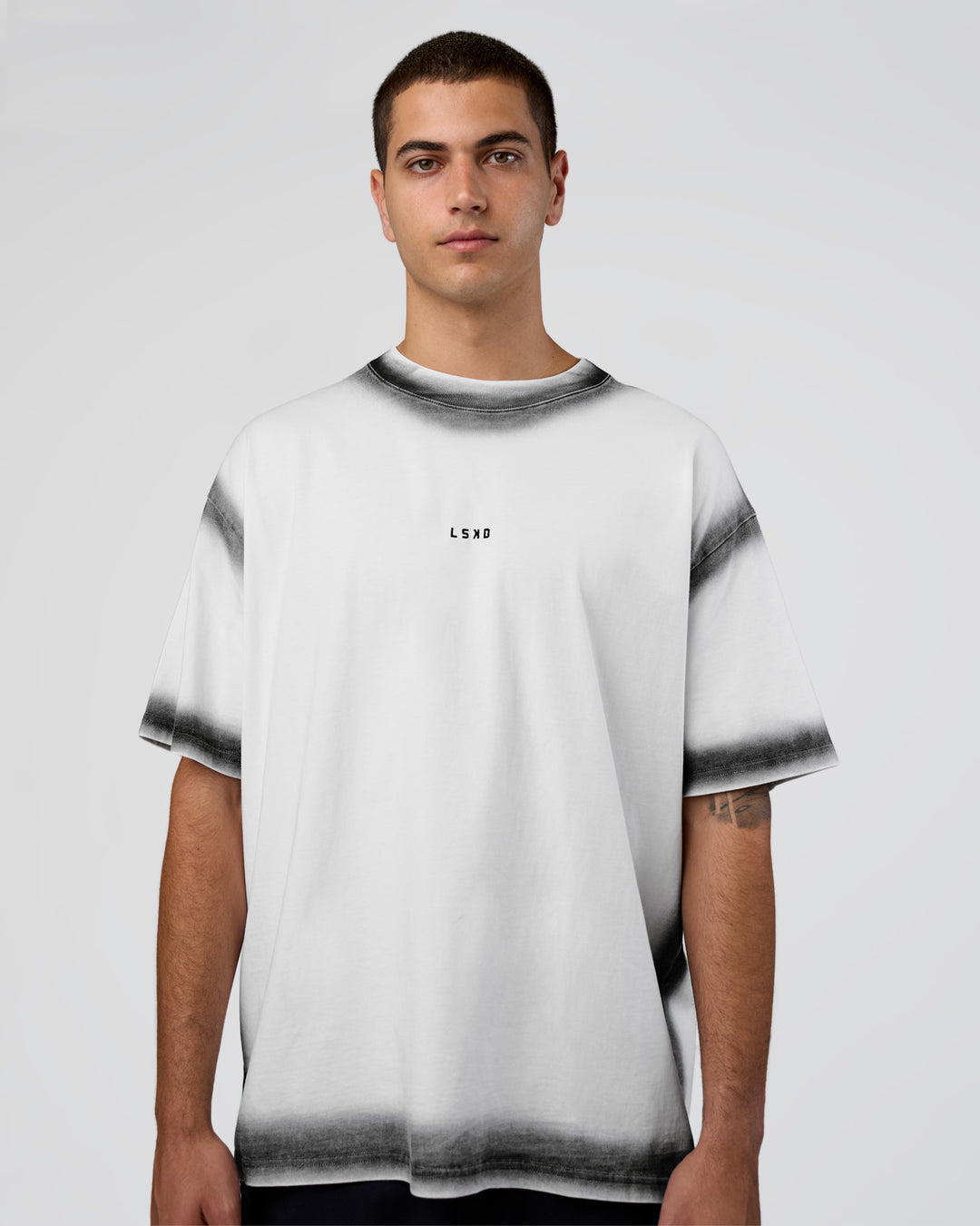 Man wearing Urban Blur Heavyweight Unisex Oversized Tee - White-Black | Model:Zoran | Size:M