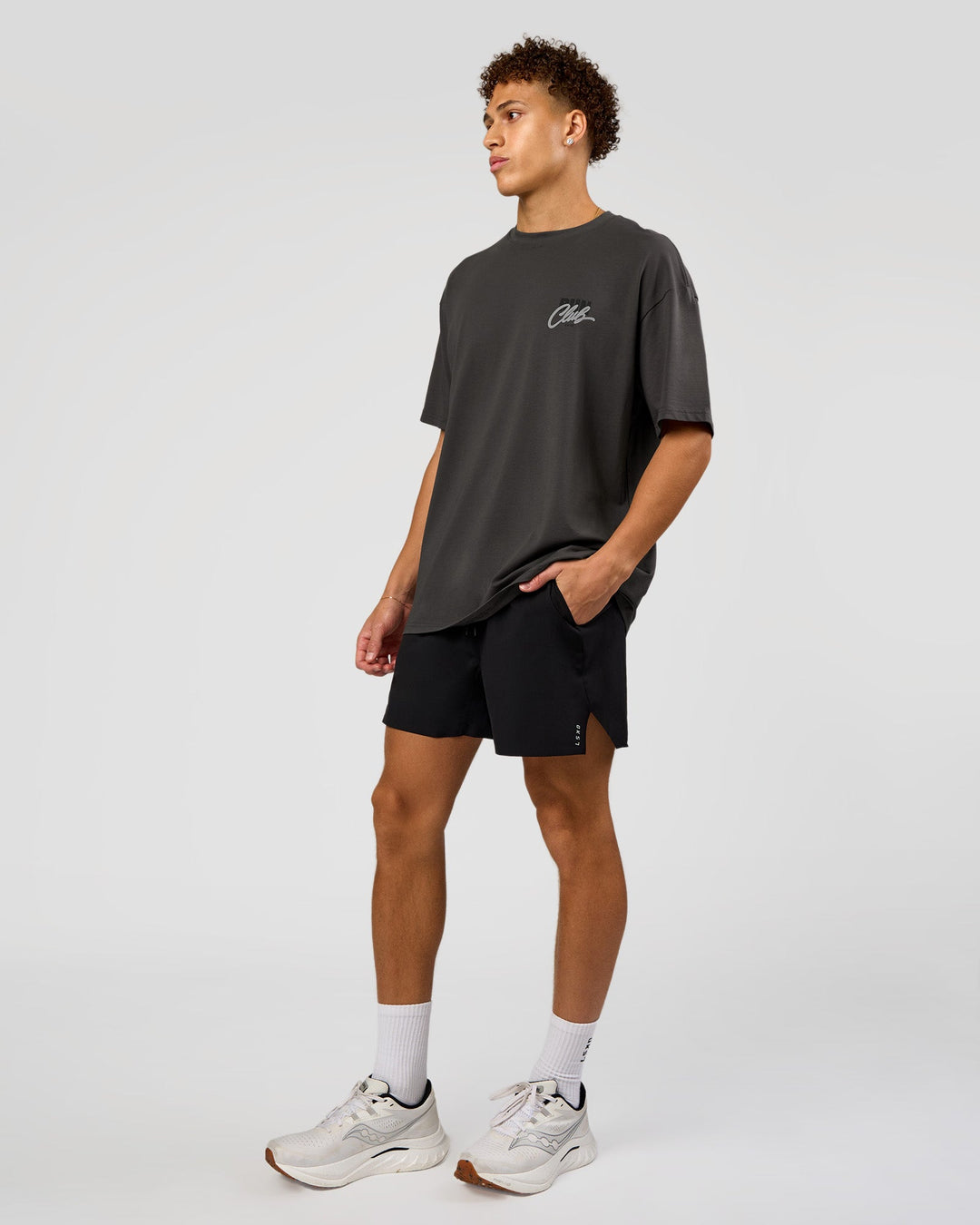 Man wearing Values Run Club FLXCotton Tee - Dark Storm-Alloy | Model:Leandro | Size:M