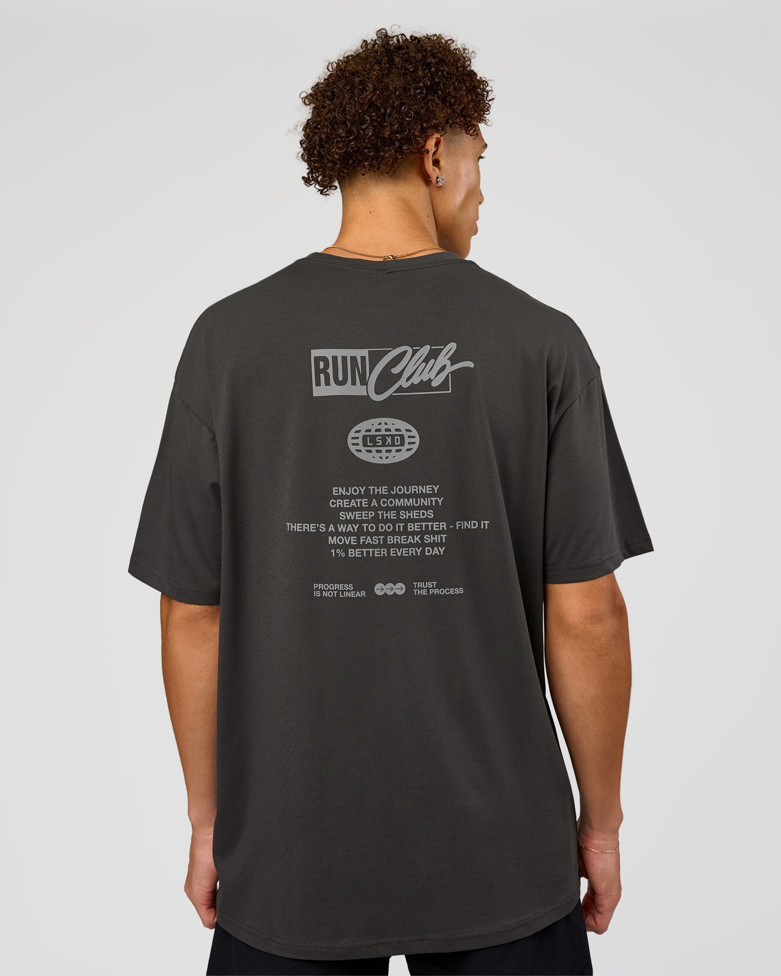 Man wearing Values Run Club FLXCotton Tee - Dark Storm-Alloy | Model:Leandro | Size:M