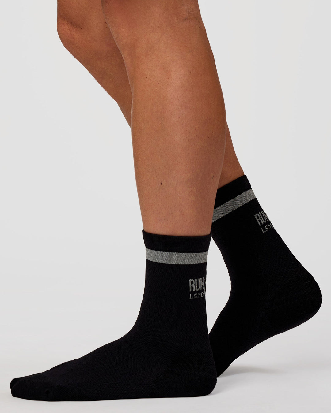 Man wearing Run Club Fast Performance Socks 2.0 - Black-Reflective