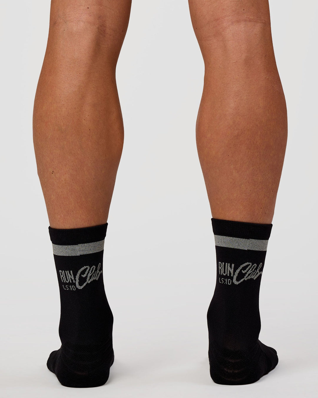 Man wearing Run Club Fast Performance Socks 2.0 - Black-Reflective