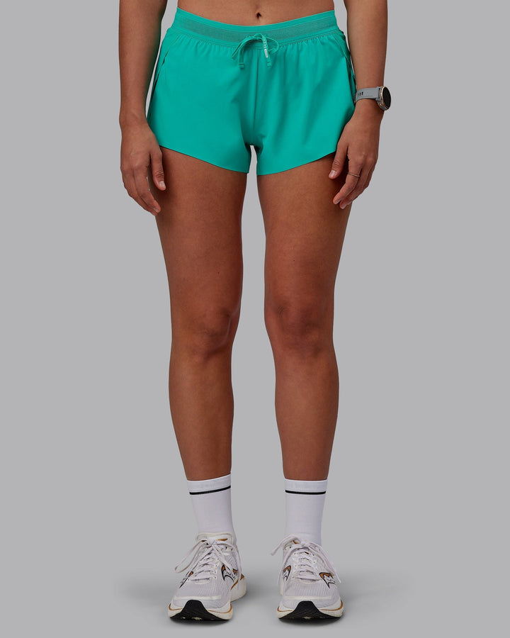 Woman wearing Accelerate Run Shorts - Atlantis
