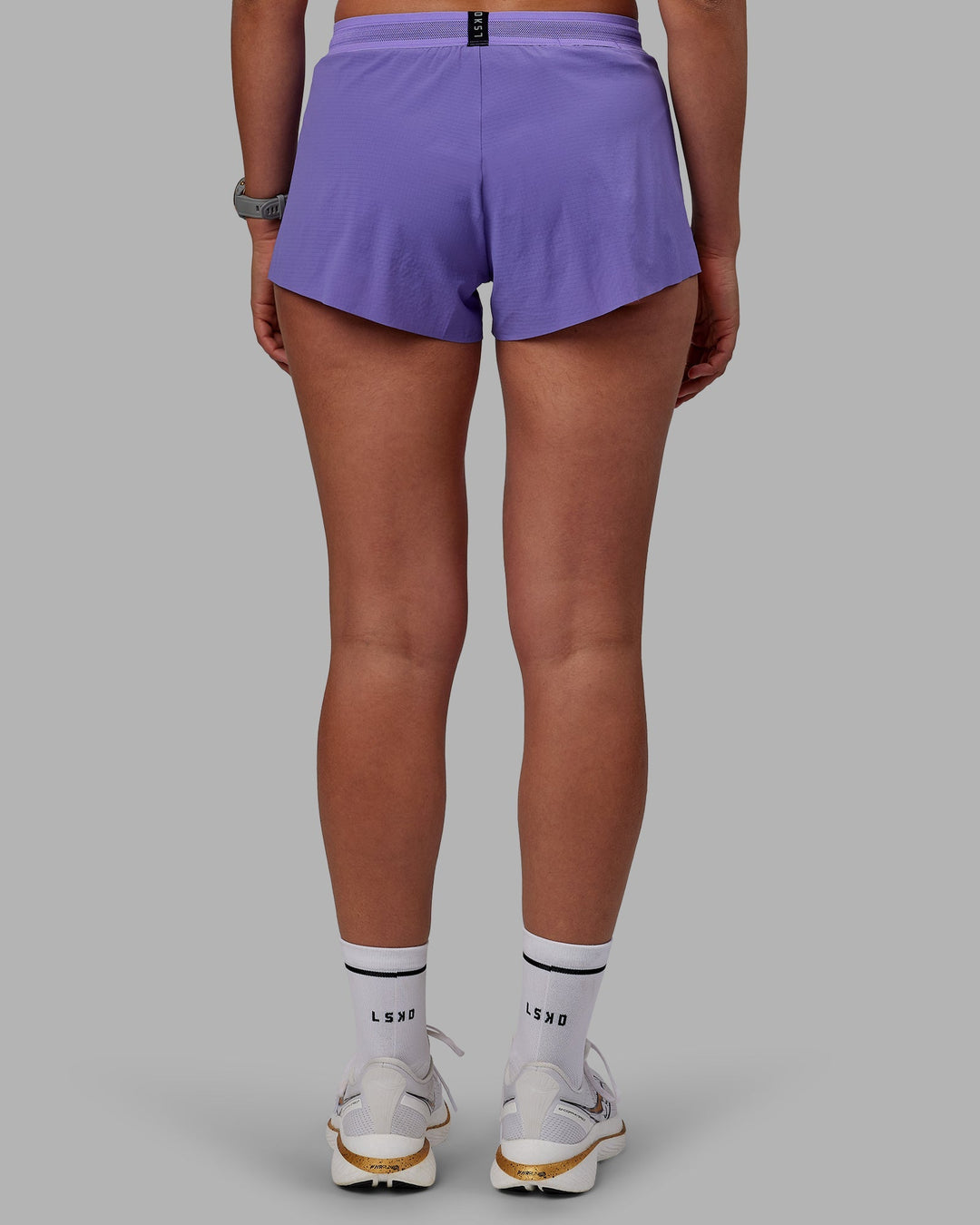 Woman wearing Accelerate Run Shorts - Dahlia Purple