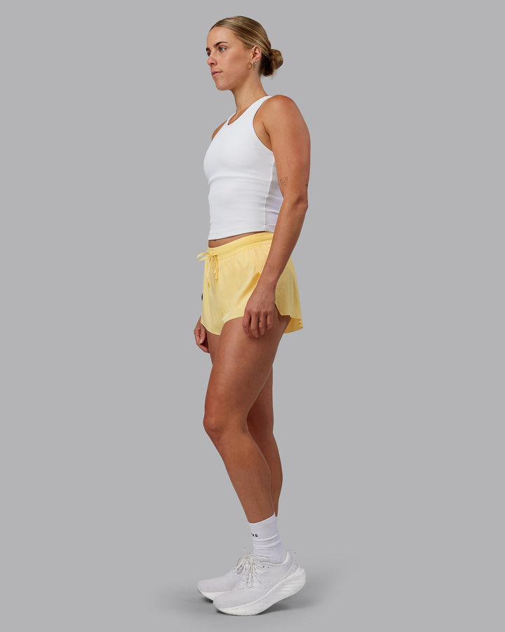 Woman wearing Accelerate 3&quot; Run Shorts - Sunflower
