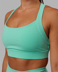 Woman wearing Advance Sports Bra - Aquatic Awe
