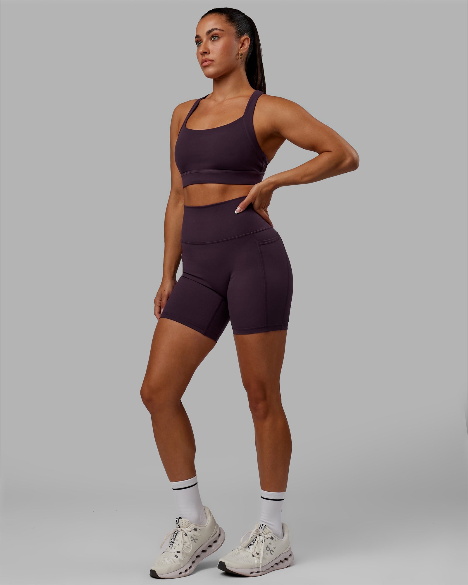 Woman wearing Advance Sports Bra - Midnight Plum