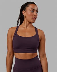 Woman wearing Advance Sports Bra - Midnight Plum