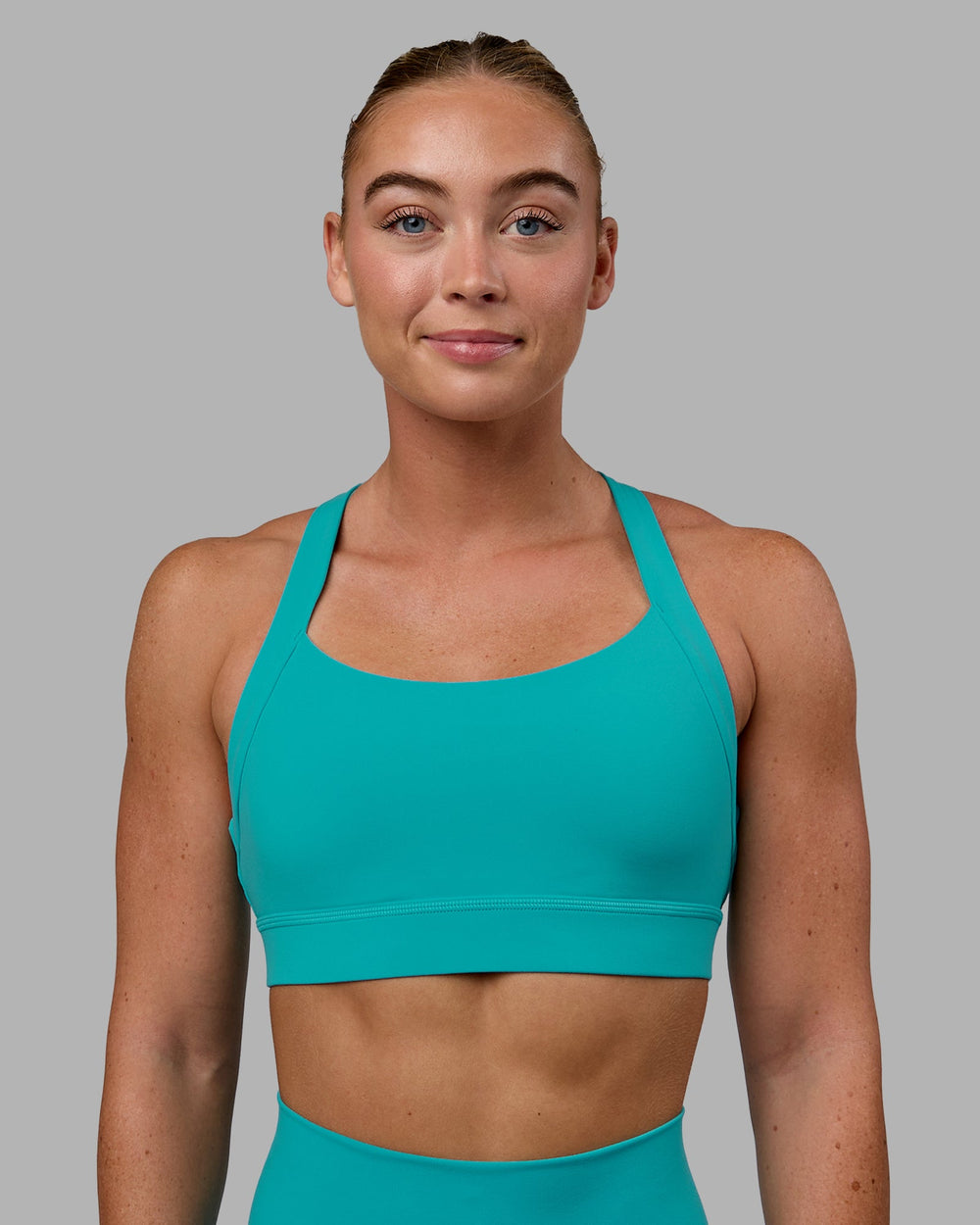 Woman wearing Advance Sports Bra - Uplift Blue