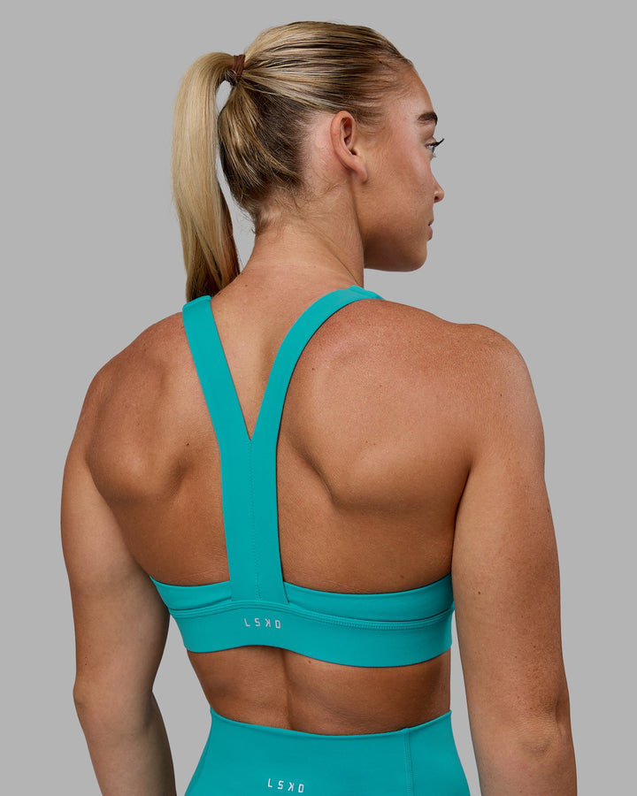 Woman wearing Advance Sports Bra - Uplift Blue
