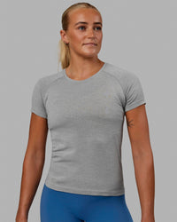 Woman wearing AeroFLX+ Seamless Tee - Light Grey Marl