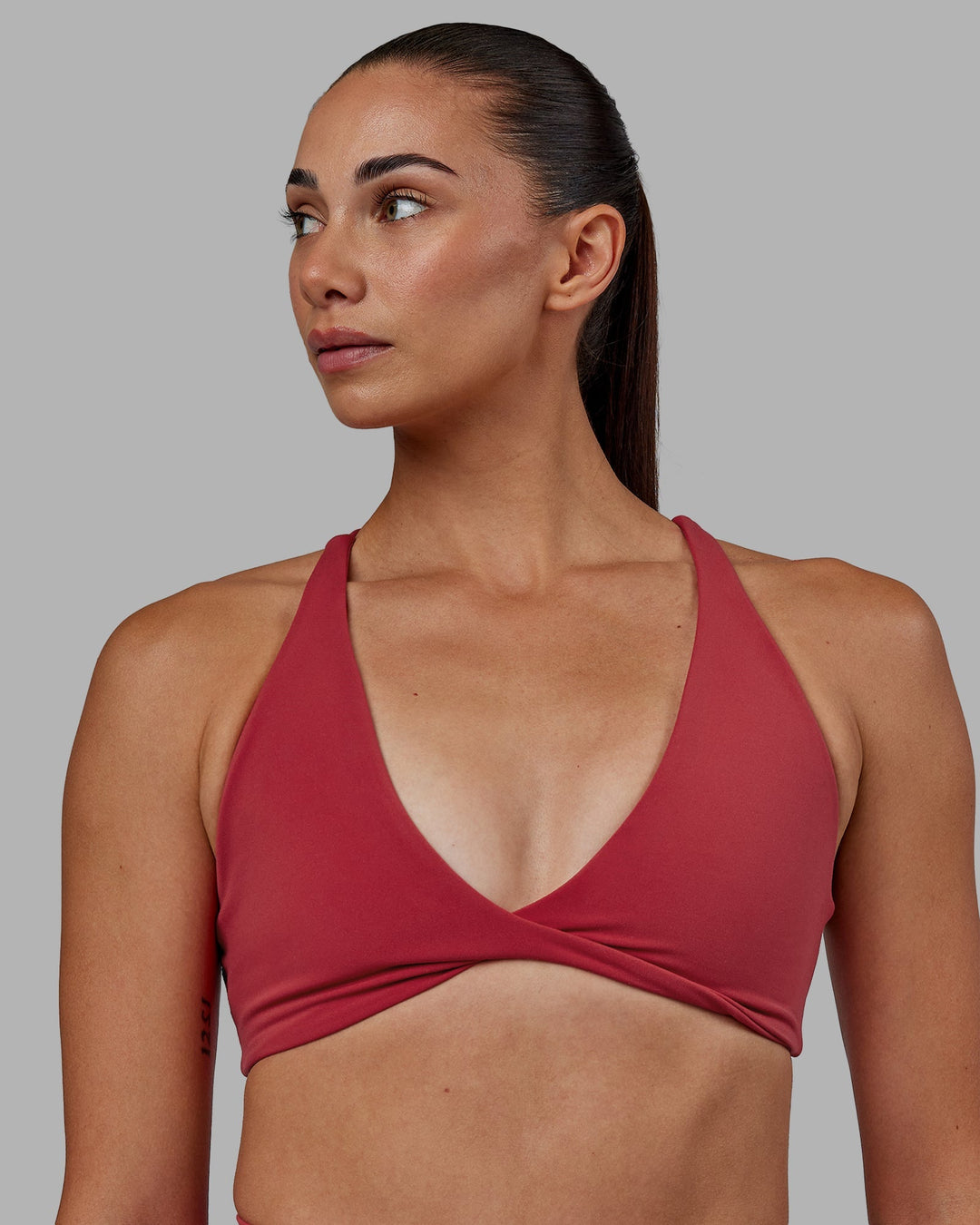 Woman wearing Agile Sports Bra - Claret