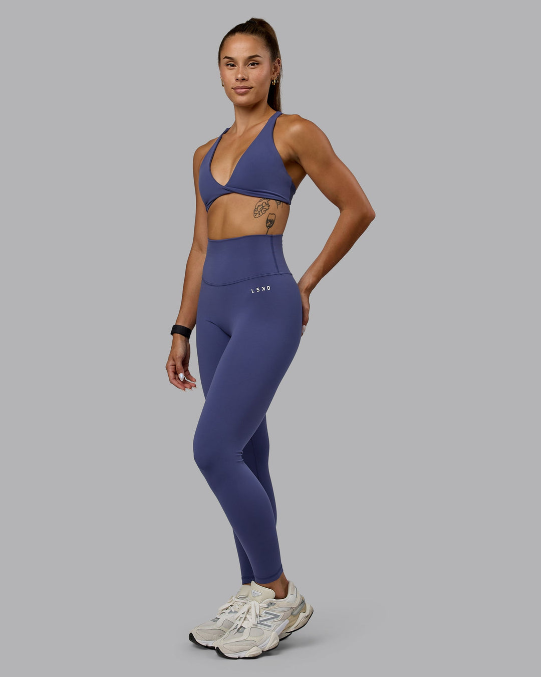 Woman wearing Agile Sports Bra - Future Dusk