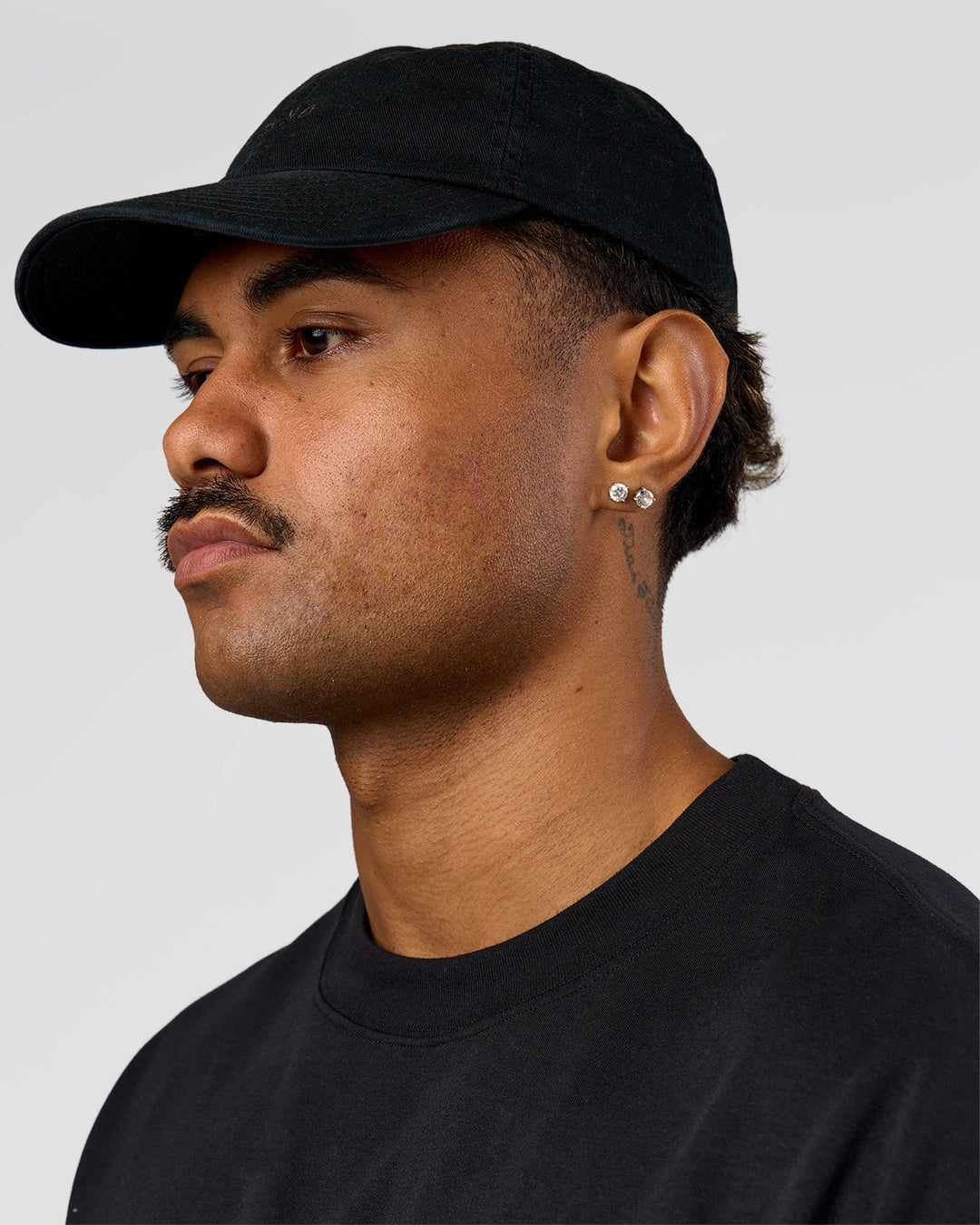 Man wearing All Day Cap in Black - view 1