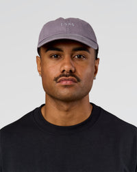 Man wearing All Day Cap in Duskstone