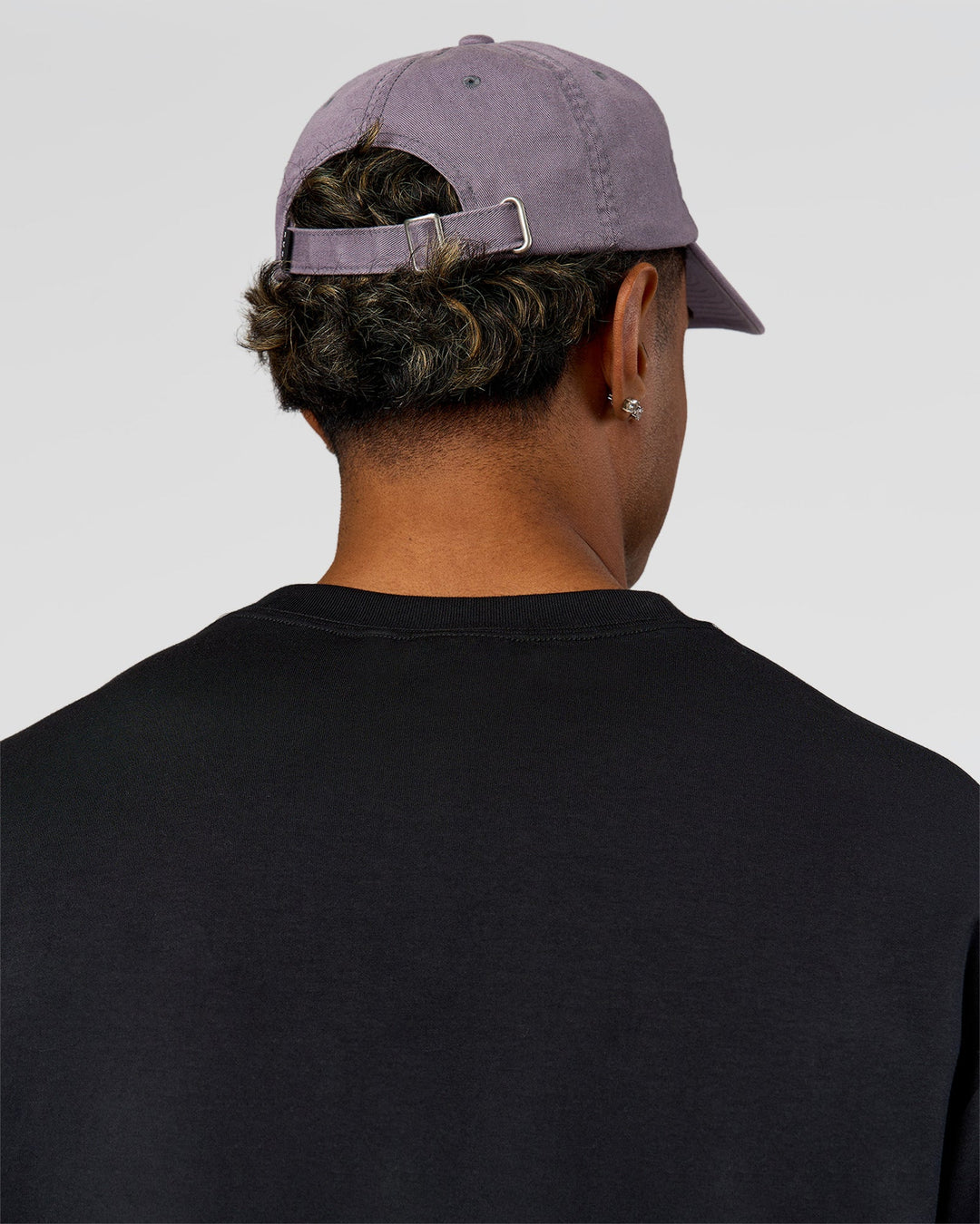 Man wearing All Day Cap in Duskstone