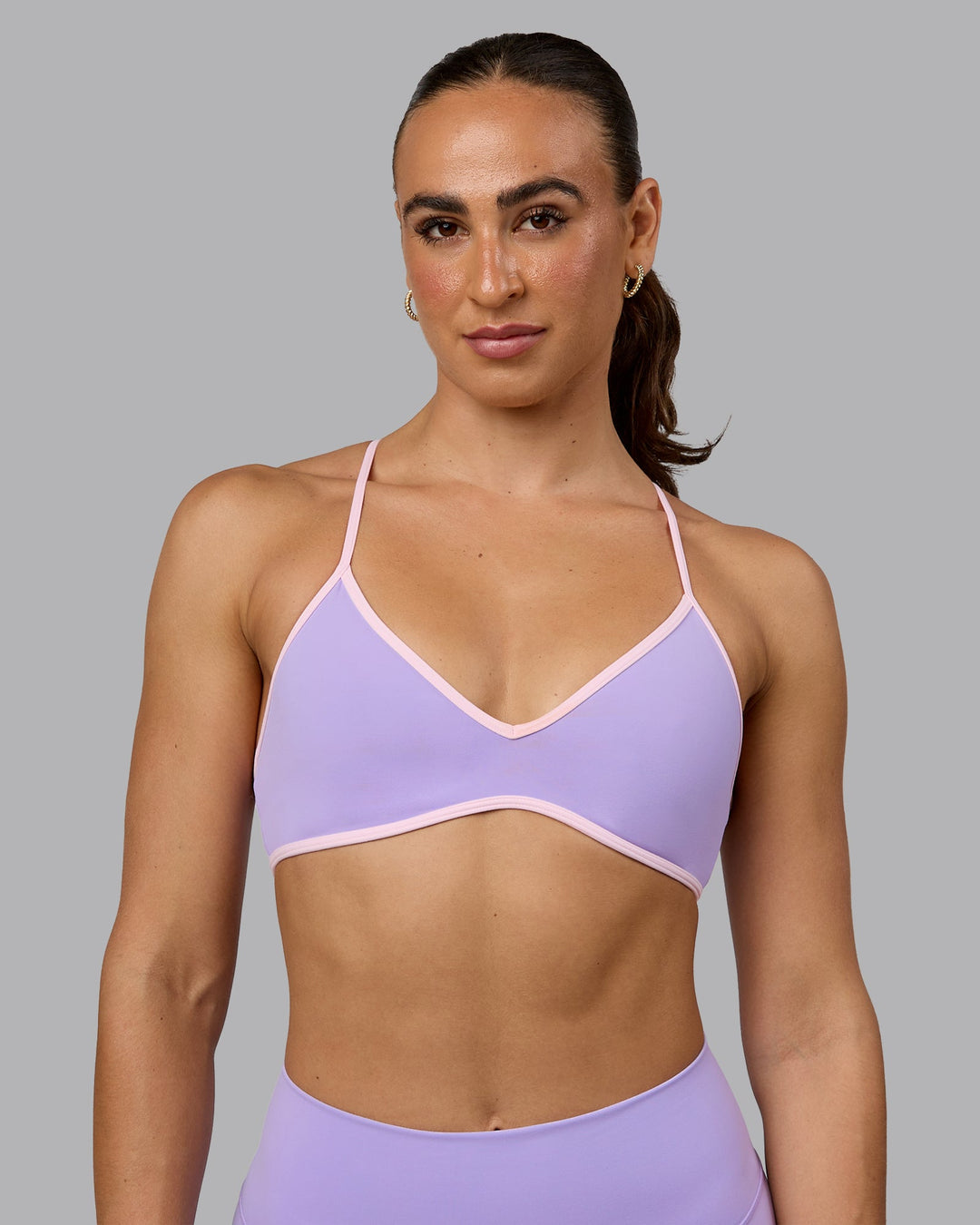 Woman wearing Ambience Sports Bra - Pale Lilac-Pale Pink