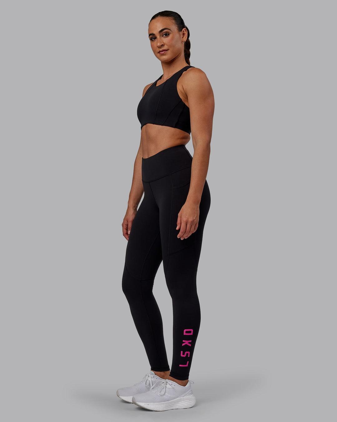 Woman wearing Ascent Sports Bra - Black