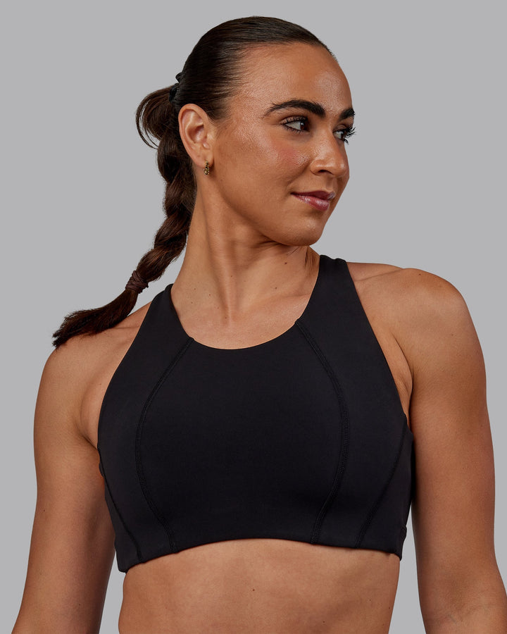 Woman wearing Ascent Sports Bra - Black
