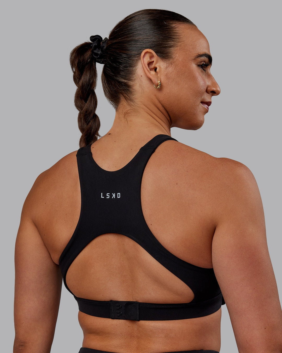 Woman wearing Ascent Sports Bra - Black