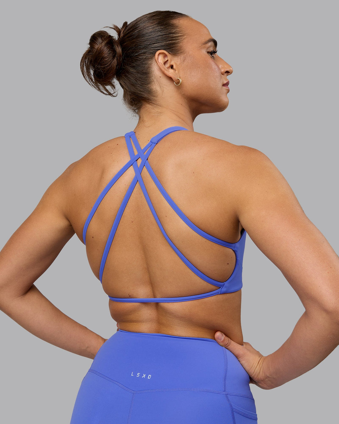 Woman wearing Aspire Sports Bra - Baja Blue