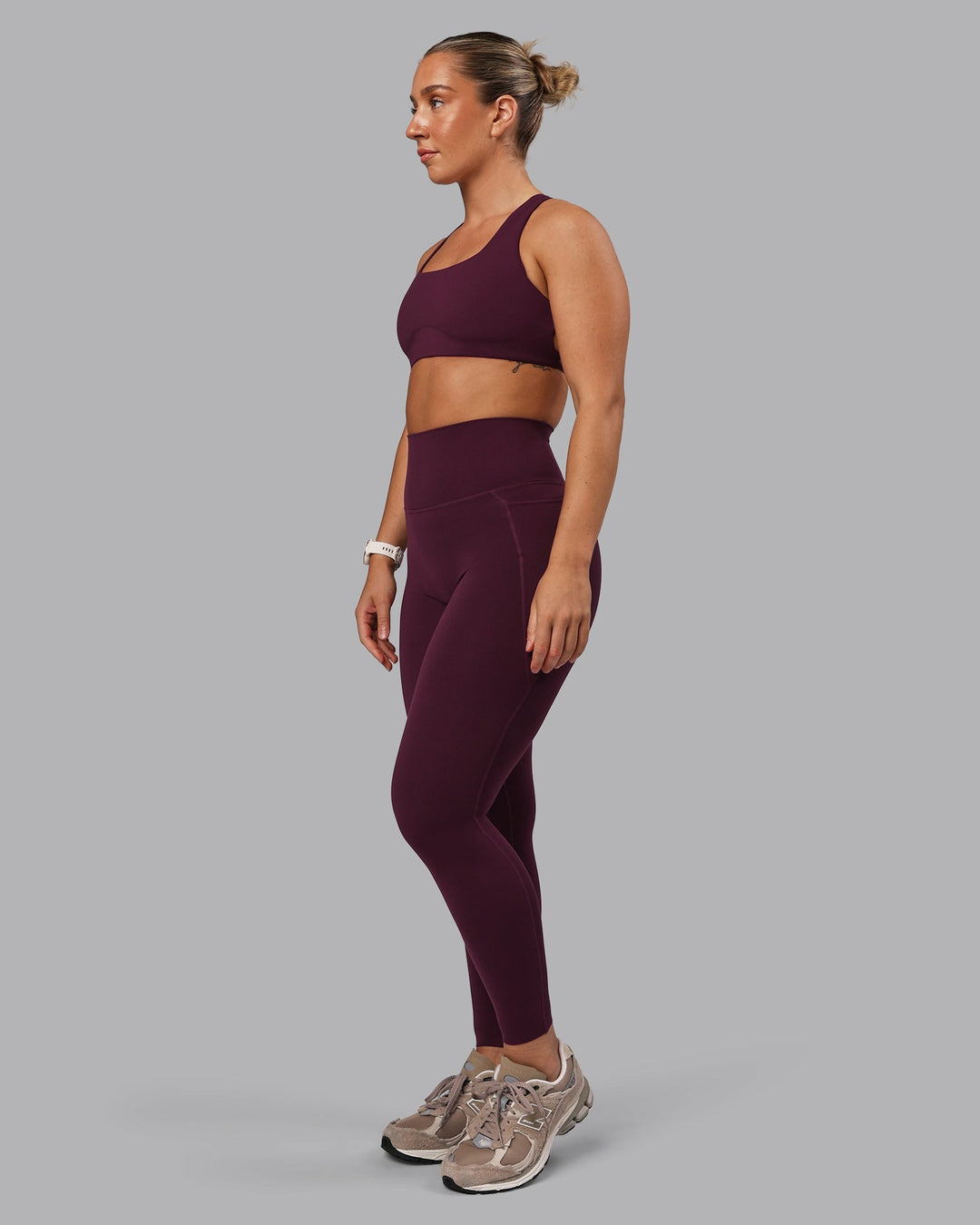 Woman wearing Aspire Sports Bra - Cherry Lacquer