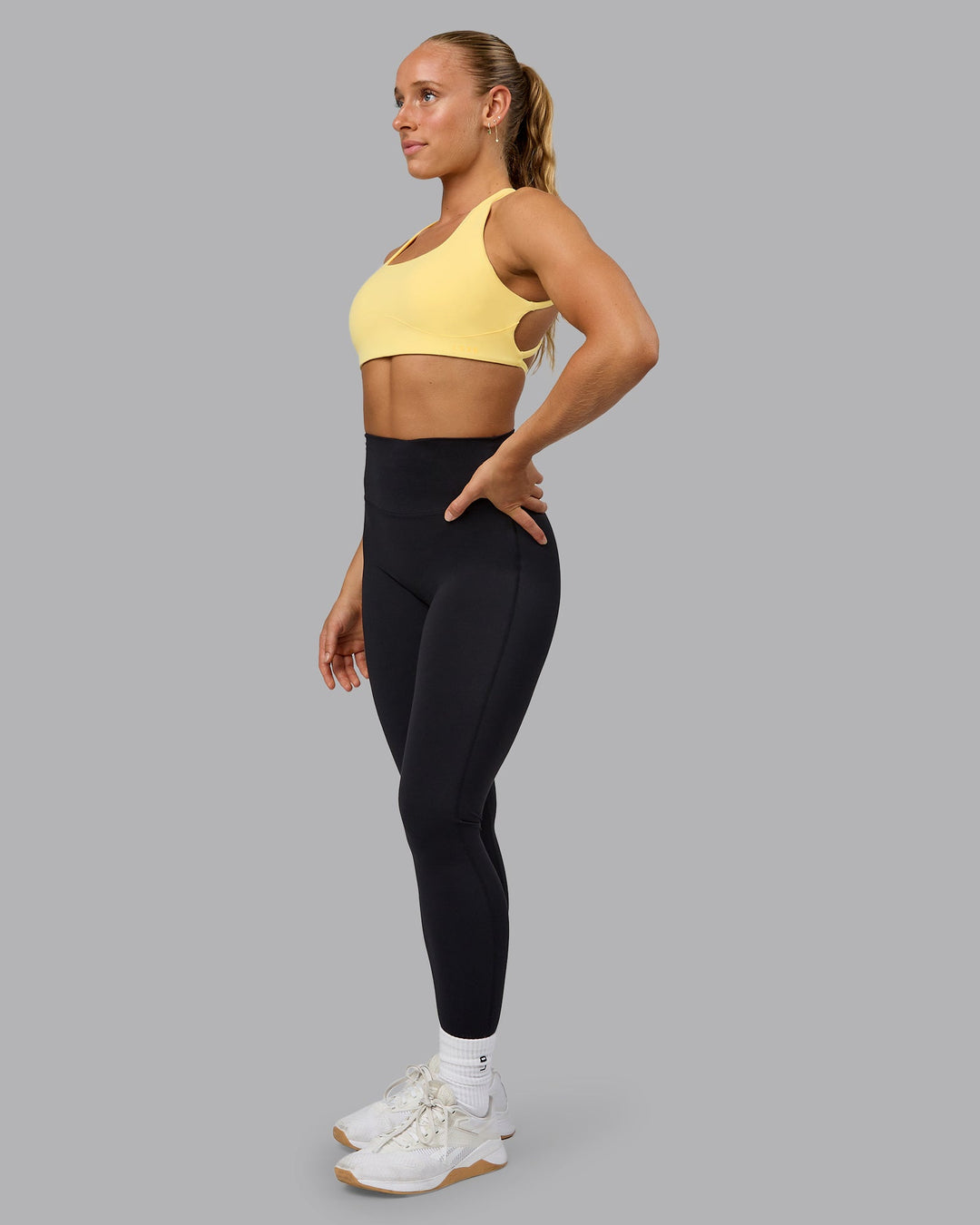 Woman wearing Aspire Sports Bra - Lemon