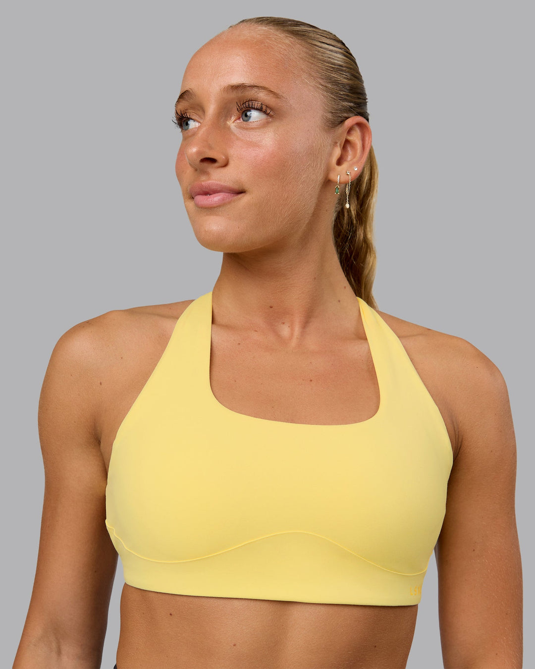 Woman wearing Aspire Sports Bra - Lemon