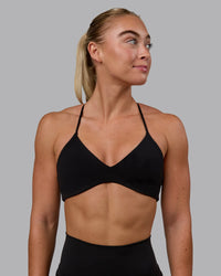 Woman wearing Aura Sports Bra - Black