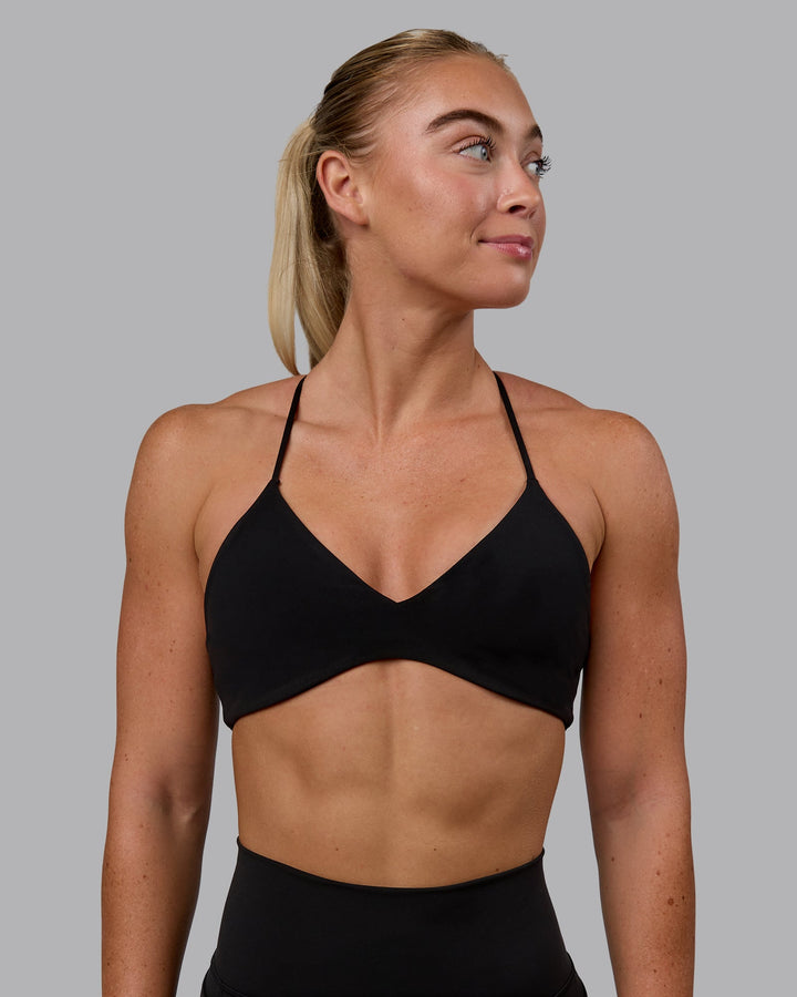 Woman wearing Aura Sports Bra - Black
