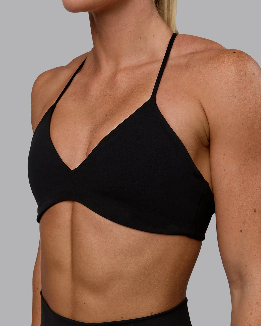 Woman wearing Aura Sports Bra - Black