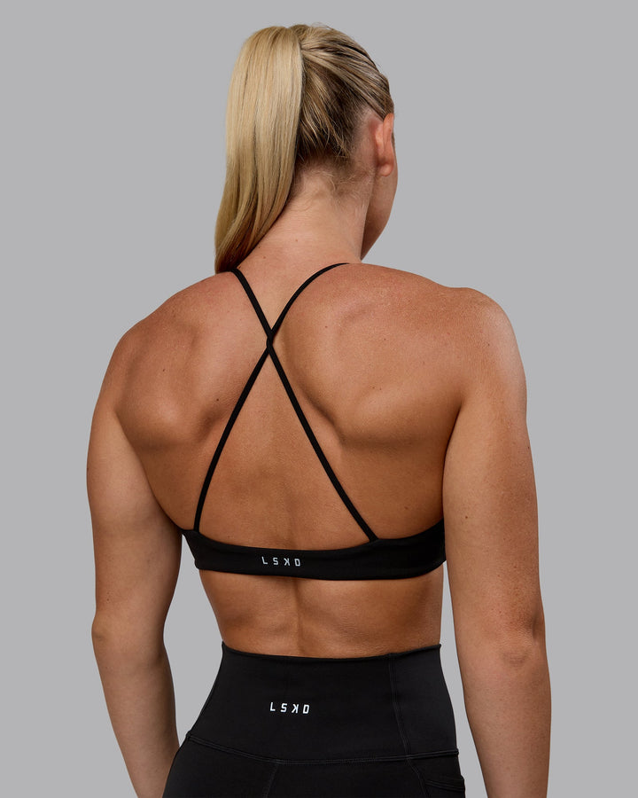 Woman wearing Aura Sports Bra - Black
