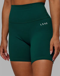 Woman wearing Base 2.0 Ultra High-Rise 6" Short - Dark Moss