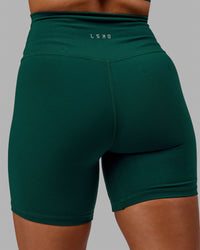 Woman wearing Base 2.0 Ultra High-Rise 6" Short - Dark Moss