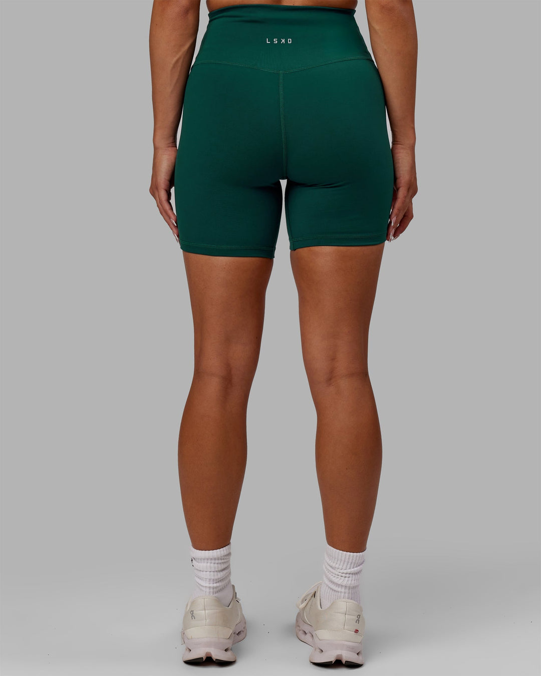 Woman wearing Base 2.0 Ultra High-Rise 6" Short - Dark Moss