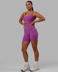 Woman wearing Base 2.0 Ultra High-Rise 6" Short - Hyper Violet